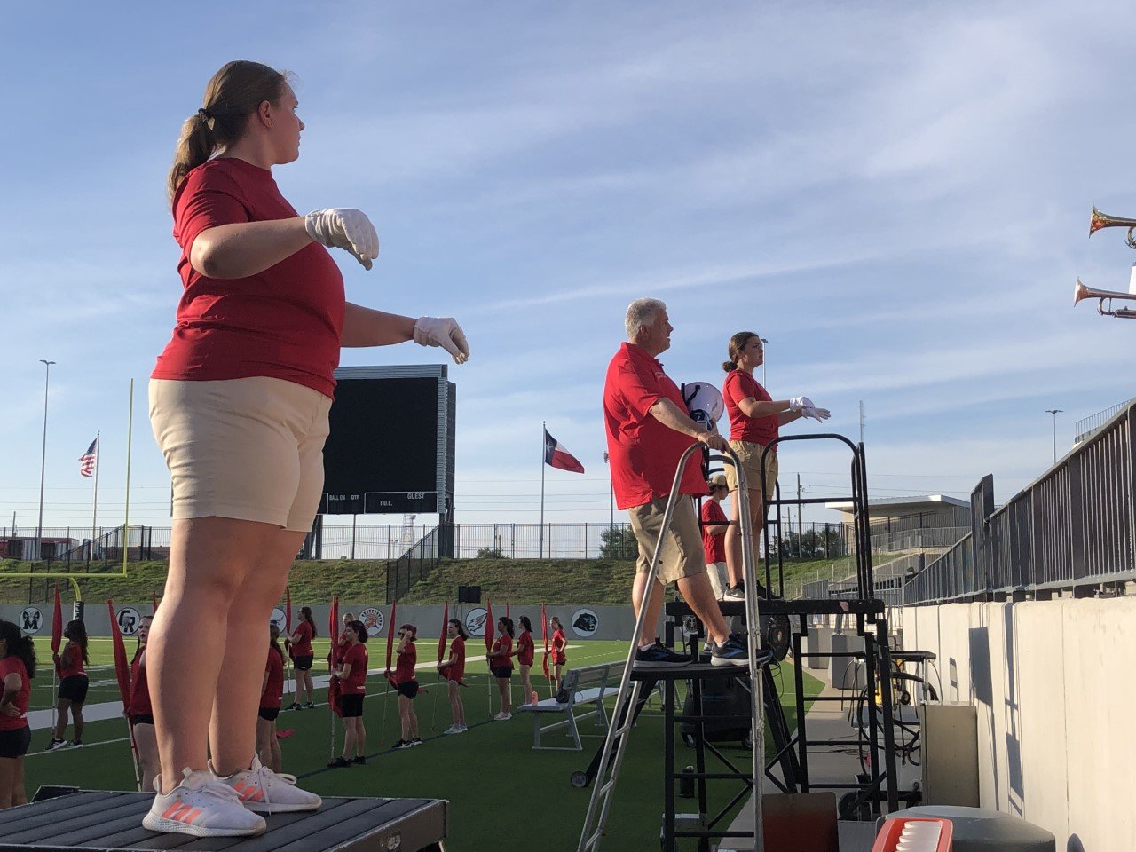 From left, Katherine Sand, Terence Gorton, and Isa Nass lead the Roarin’ Band from Tigerland during the Katy pep rally Monday at Legacy Stadium. Nass is the head drum major. Sand is a drum major. Gorton is head band director.